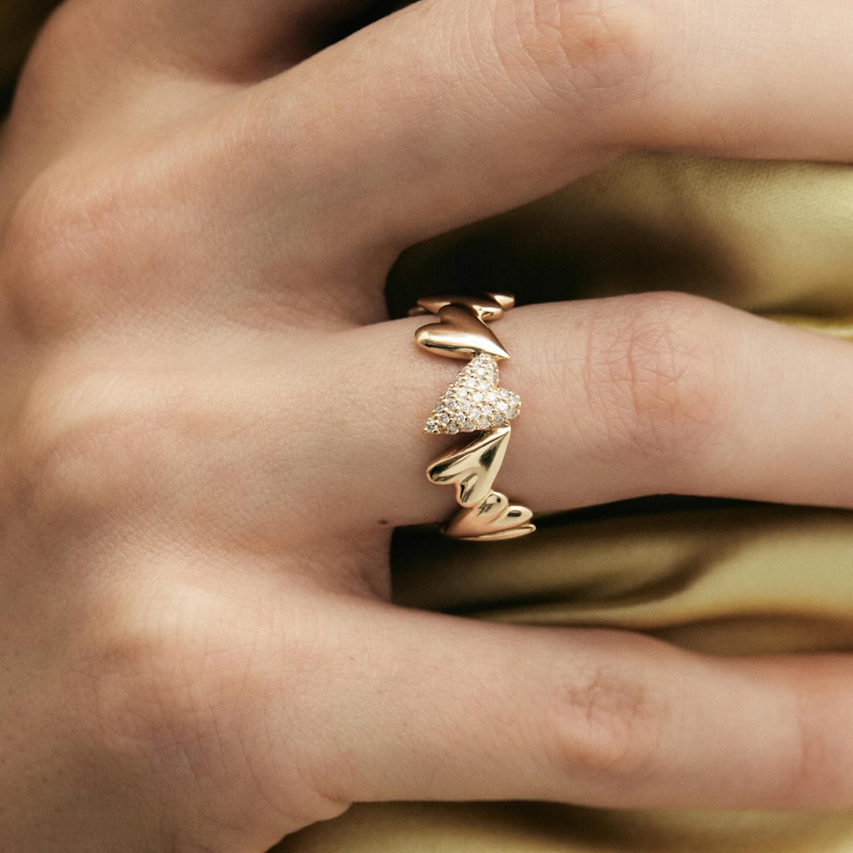 18K Gold Ring with Interlocking Heart Design and Sparkling Zirconia