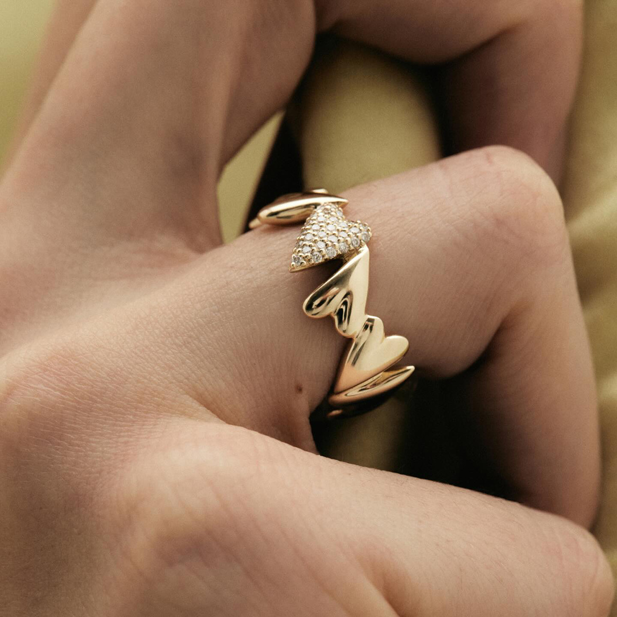 18K Gold Ring with Interlocking Heart Design and Sparkling Zirconia