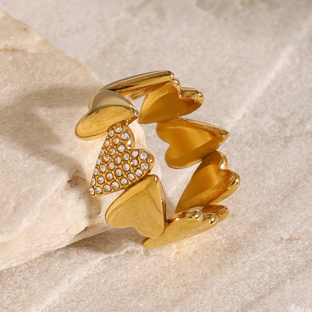 18K Gold Ring with Interlocking Heart Design and Sparkling Zirconia
