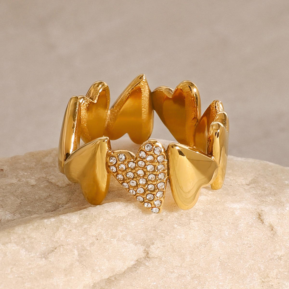 18K Gold Ring with Interlocking Heart Design and Sparkling Zirconia